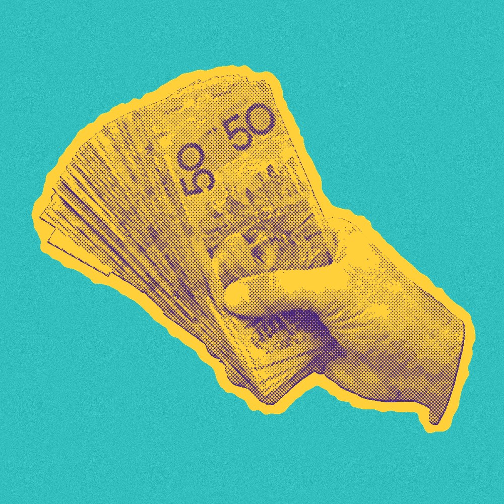 Newsprint cut-out of a hand holding fifty dollar notes.